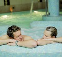 A couple relaxing on a 3 night romantic luxury spa break for couples
